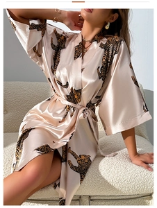 Detail view of the champagne silk robe with leopard print and a matching waist belt