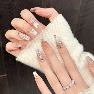 Sparkling pink rhinestone press-on nails with luxury gem accents in long coffin shape
