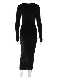 Detailed back view of a black slim-fit velvet dress with long sleeves and elegant draping