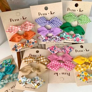 3-pack set of Korean style floral and plaid bow hair clips for girls on display card