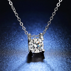 Classic four-prong round moissanite pendant necklace in polished silver finish
