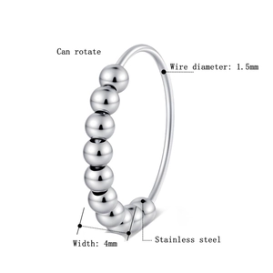 Macro view of stainless steel rotating bead anxiety ring showing 4mm bead width detail