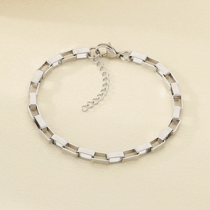 Detail of silver rectangular link chain bracelet with lobster clasp and extension