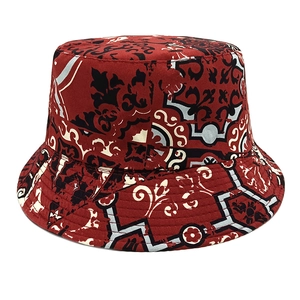 Detailed top view of a bohemian bucket hat featuring vintage red baroque totem prints