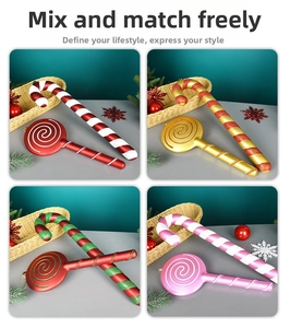Detail view of festive candy cane and lollipop ornaments in multiple holiday colors