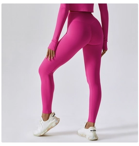 Detail view of high-waisted rose red yoga set with slimming fit and lifting seams