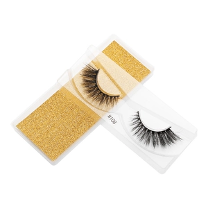 Detail of 3D faux mink eyelashes style #108 in a clear box with gold glitter insert