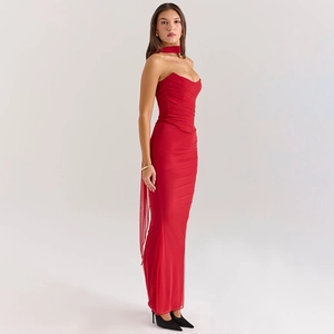 Detail of red tube maxi dress with matching neckpiece and elegant back ribbons