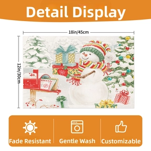 Detail view of 18x12 inch linen placemat with watercolor snowman and Christmas tree print
