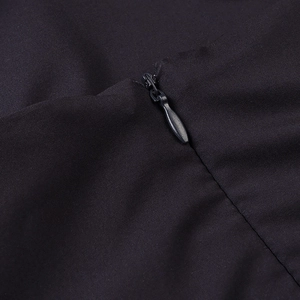 Close-up of invisible zipper closure on high-quality woven fabric of floral dress