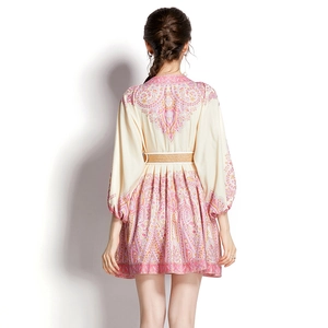 Back view of bohemian V-neck mini dress with lantern sleeves and woven belt