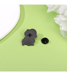 Macro shot of the black enamel pin back with a matching durable rubber clutch closure
