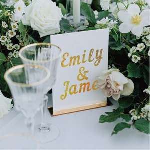 Elegant 1-inch glitter alphabet stickers on wedding place card with gold metal base