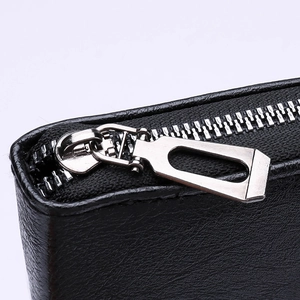 Minimalist black leather long wallet with silver zipper and high-quality stitching detail