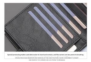 Close-up of durable card slots in a black slim leather wallet with functional metal zipper