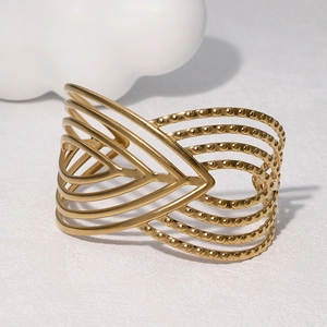 Bracciale rigido minimalista in acciaio inox dorato 18k con linee geometriche