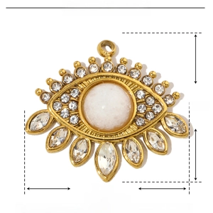 Detail showing 17x19mm gold evil eye pendant with natural stone and rhinestones