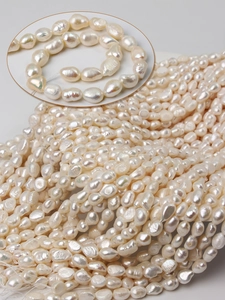 Macro shot of irregular white baroque freshwater pearls for luxury jewelry making