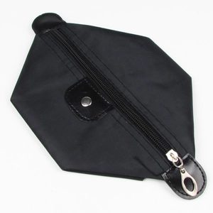 Close-up of a black hexagonal nylon makeup bag with high-quality zipper and silver metal pull