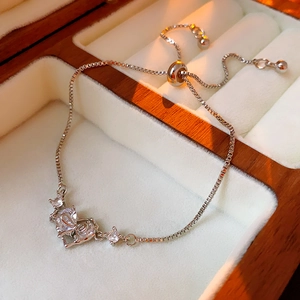 Detail of adjustable silver box chain with zirconia heart and bead sliding clasp
