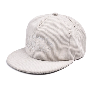 Close-up of off-white corduroy texture and white sun embroidery on flat brim baseball cap