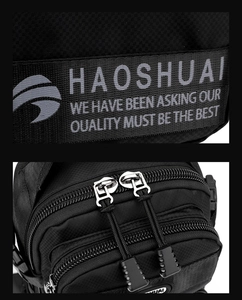 Detail of black crossbody bag showing reinforced stitching and premium metal zippers