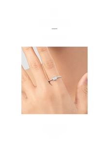 Detail of S925 sterling silver ring featuring an emerald-cut centerpiece and paved diamonds
