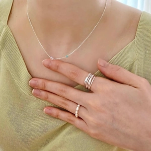 925 Sterling silver necklace with zircon, layered rings and pearl ring worn by model