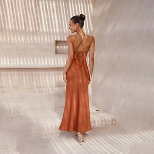 Detail of cross tie backless design on sleek copper satin slim fit maxi dress