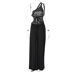 Detail showing back lace-up design of a sexy black backless maxi dress with side slit
