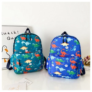 Detail of dinosaur print backpacks with dual zippers and side mesh pockets for kids