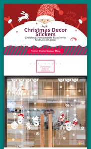 Detail of white Christmas snowman and elk static window stickers on a glass door