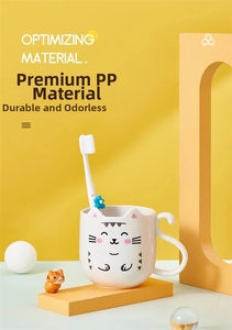Detail of children's cartoon cat mouthwash cup with unique cat tail handle and toothbrush