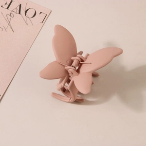 Matte dusty pink butterfly hair claw clip made of ABS with durable metal spring