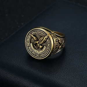 Macro detail of Fraternal Order of Eagles signet ring in gold-plated stainless steel