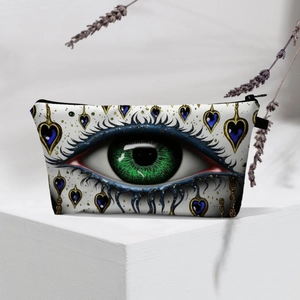 Detail of evil eye makeup bag on white stand with artistic lavender decoration