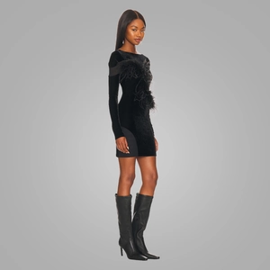 Chic black velvet mini dress featuring elegant side feather trim and long sleeves