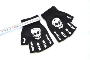Glow-in-the-dark fingerless gloves with white skull skeleton bone print measuring 10cm wide