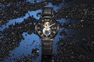 Detailed macro view of black world map watch dial with roman numerals and calendar date
