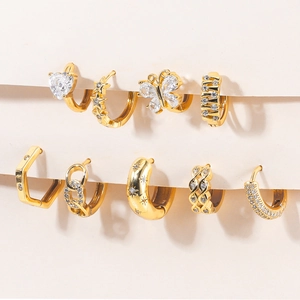Detailed set of gold earrings featuring zircon butterflies, stars, and heart designs