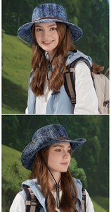 Detail view of washed denim sun hat with wide brim, leather strap and adjustable chin cord