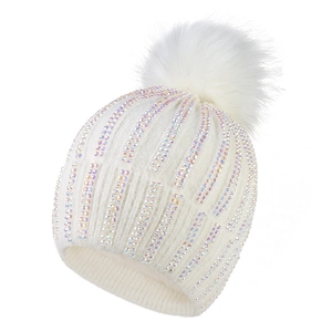 White winter knit beanie for women with sparkling rhinestones and a large faux fur pompom