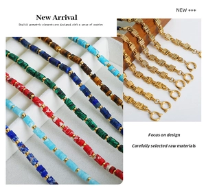 Detail of natural stone beaded bracelets and golden chains with lapis and malachite