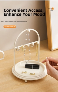 Arched jewelry storage rack with bottom tray displaying necklaces and earrings