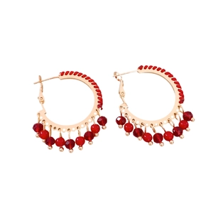 Ethnic gold hoop earrings with red woven cord and beaded tassel charms for women