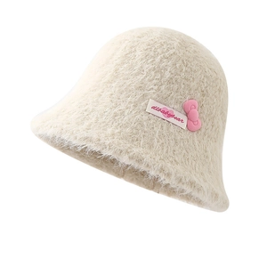 Off-white plush bucket hat with a pink 3D bow and sweet woven label for women
