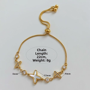 Detailed view of adjustable gold star bracelet with mother of pearl and cubic zirconia