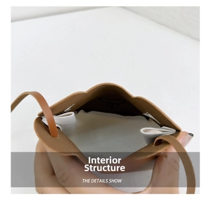 Detailed view of the internal structure and lining of the bear crossbody coin bag