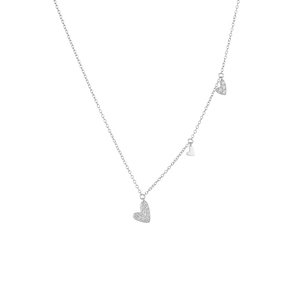 Detail of sterling silver necklace with three zircon-encrusted heart pendants
