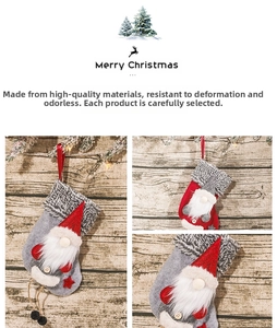 Detail view of a Christmas stocking with gnome and sequined red hat on wood background